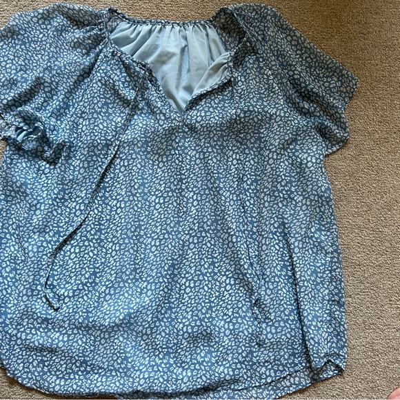 Polyester, blue & white blouse with two strings in the front. Flowy & runs big - Picture 1 of 3